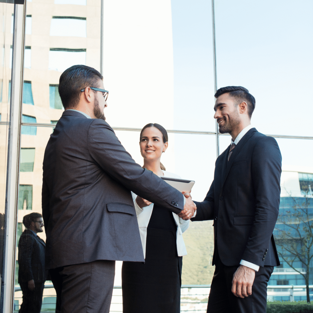Business professionals shaking hands